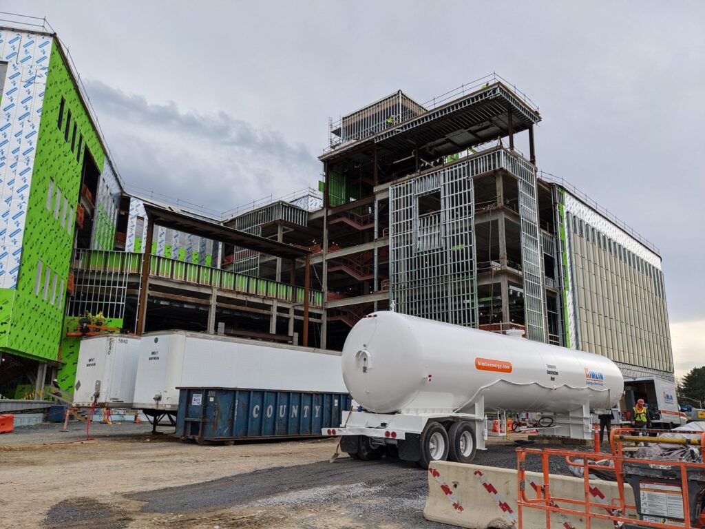 Kimlin Energy temporary construction heat tank and service truck at a multi-story commercial building under construction in the Hudson Valley