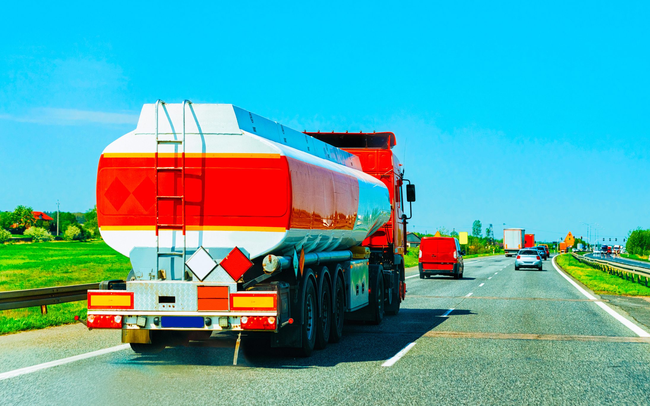 Truck with liquid or oil storage in road or highway of Czechia. Lorry with service tanker cistern at logistics work. Semi trailer tank. Cargo car drive. Freight delivery. Transport export industry