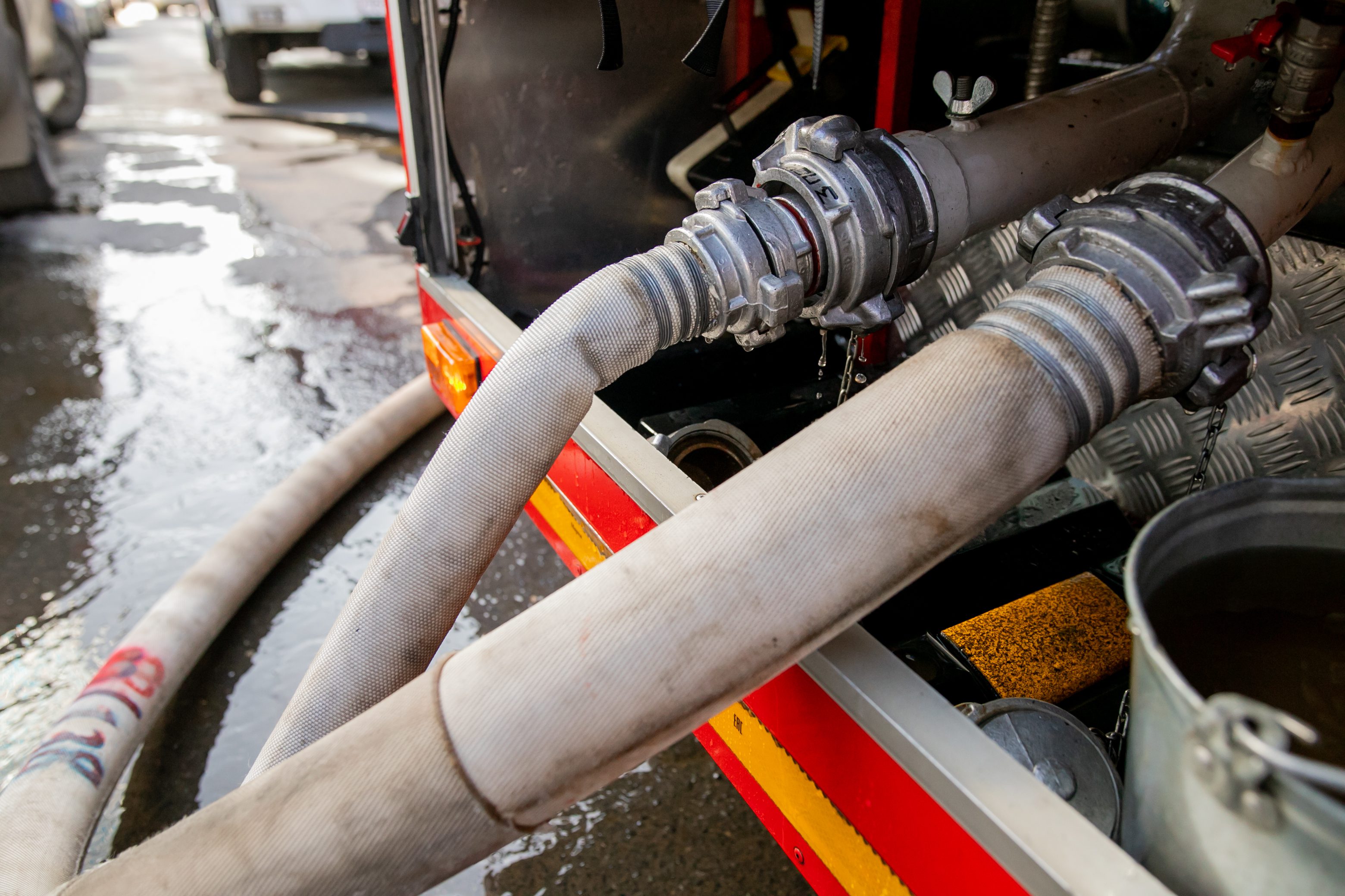Fire hoses at a fire engine, high water pressure