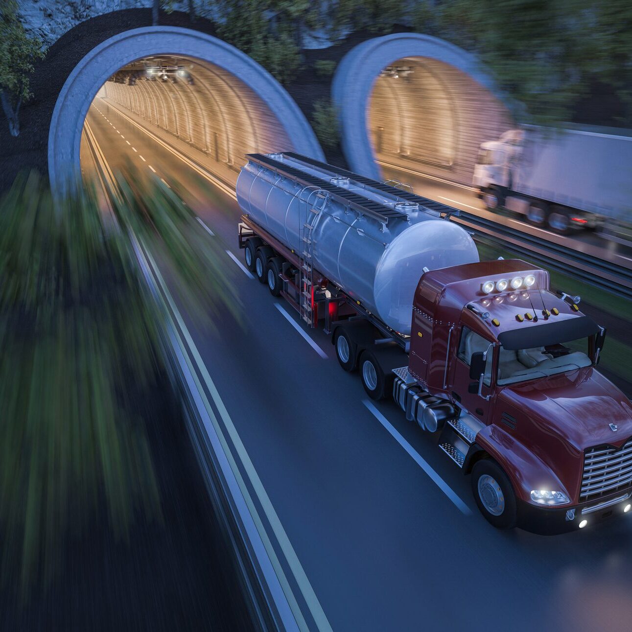 Illuminated tunnels at sunset with trucks in motion on the road